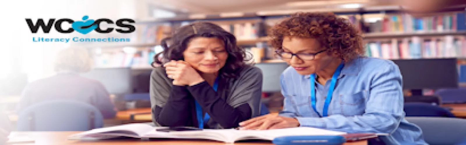 Two women studying with text "WCCS Literacy Connect"